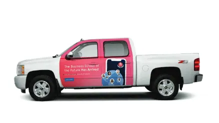 A truck with a pink and white wrap